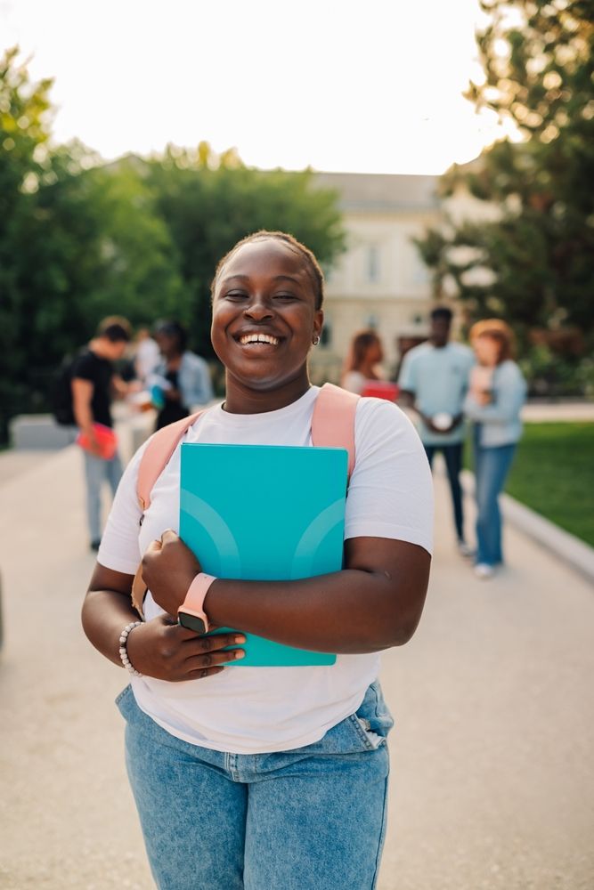 Portrait,Of,Cheerful,Multicultural,University,Student,Girl,Standing,At,College